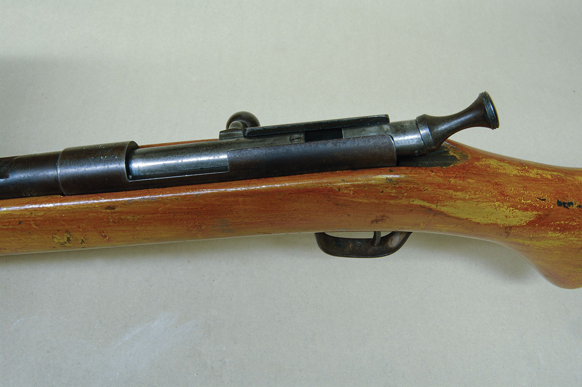Closing the bolt leaves the safety standing up, and it must be physically moved down to fire the rifle.